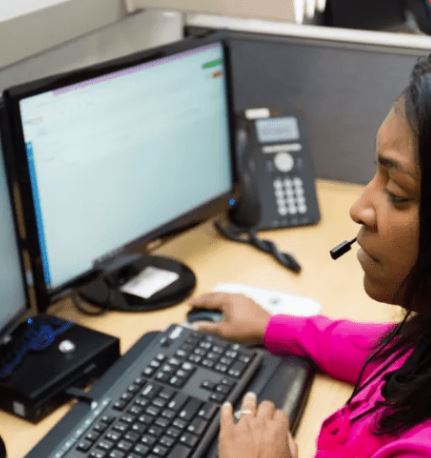 Operator at computer on a call