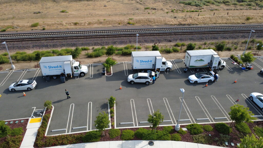 drone view of three shredding trucks Shred it 2025 drone view of three shred it trucks