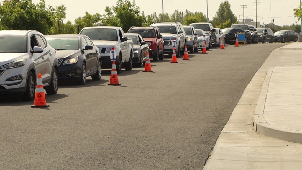 line of cars mid way down lot Shred it 2025 line of cars waiting at shred it 2025