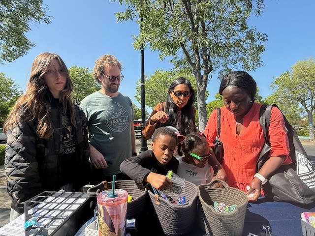 Family booth goers picking prizes STEM 2025