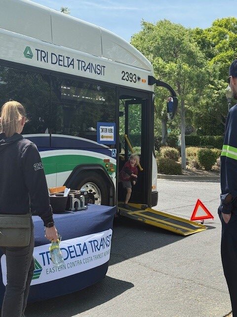 Child in doorway of bus at STEM event