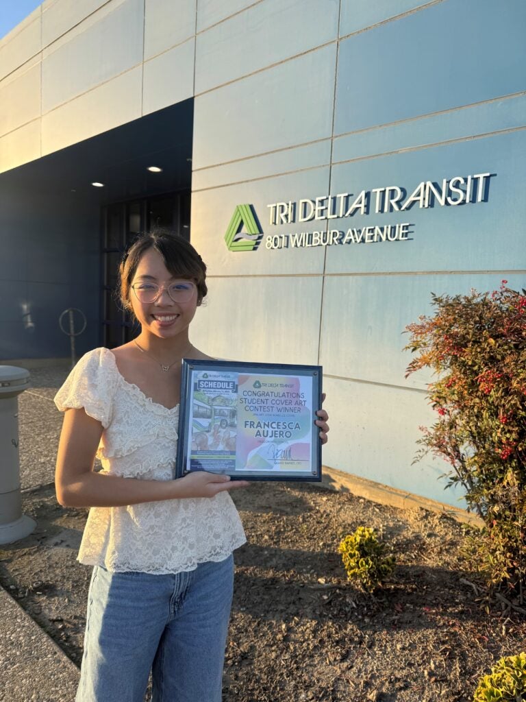 Francesca Aujero holding certificate 