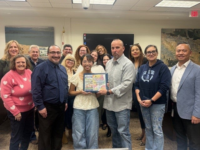 Board of Directors with contest winner, Asst. Principal and Teacher 